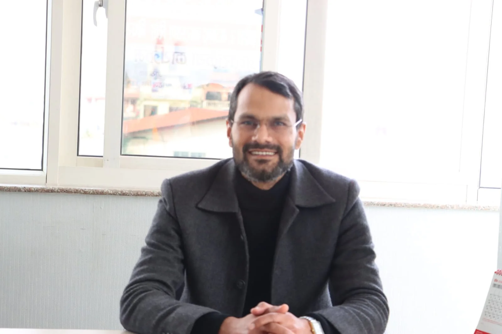 Anil Kumar Mahaseth seated for a policy conversation in his office